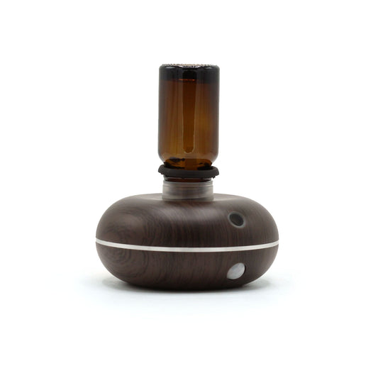 Plastic Aroma Diffuser – USB-C Motion Sensor compact waterless diffuser with amber bottle, wood-grain plastic base, motion sensor
