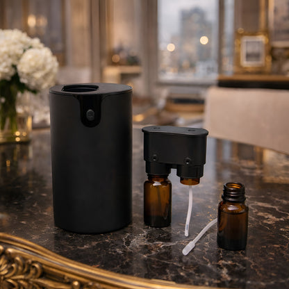 Plastic Essential Oil Nebulizer – USB-C portátil de plástico con frascos de aceite esencial en mesa, diseño compacto sin agua