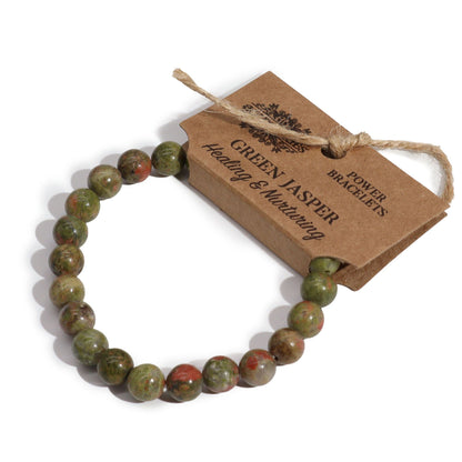 Alt Tag: Power Bracelet – Green Jasper pulsera de cuentas de jaspe verde con etiqueta kraft, joyería artesanal de piedra natural