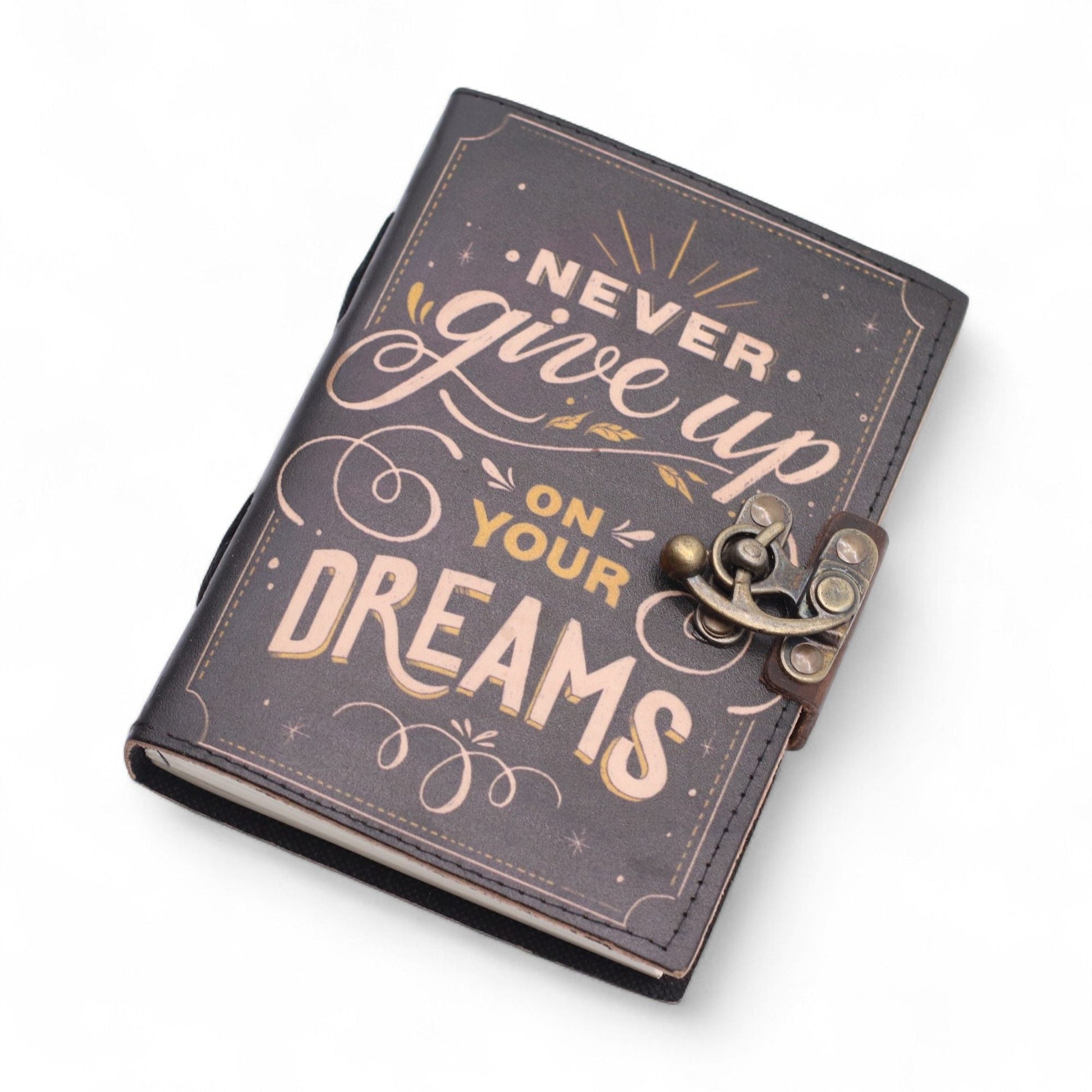 Alt Tag: Printed Leather Notebook – 17.8 × 12.7 CM Never Give Up On Your Dreams, leather cover with clasp and "Never give up on your dreams" print