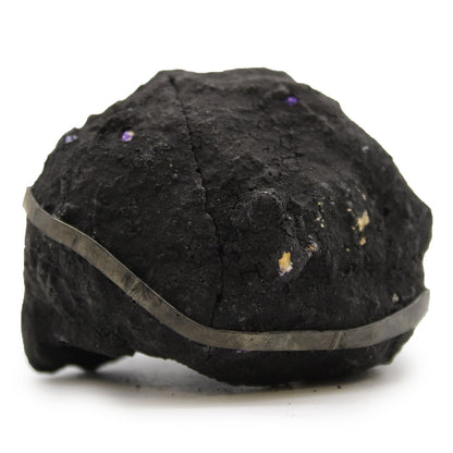 Purple Calcite Geode – Black Rock 8.5x6 CM, black rock geode specimen with purple calcite crystal spots on white background