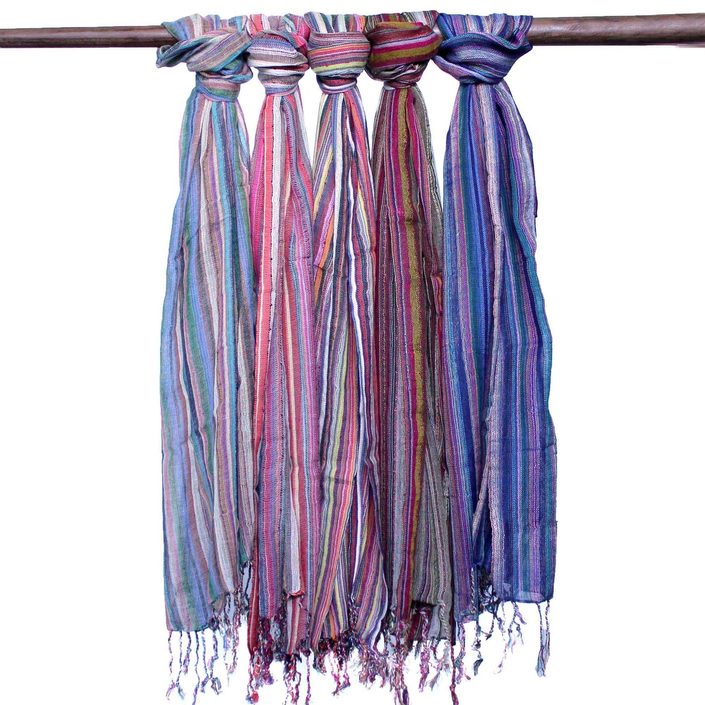 Radiant Cotton Boho Scarf – 56x183 CM, colorful striped cotton scarf with fringed ends hanging on a wooden rod