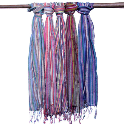 Radiant Cotton Boho Scarf – 56x183 CM, colorful striped cotton scarf with fringed ends hanging on a wooden rod