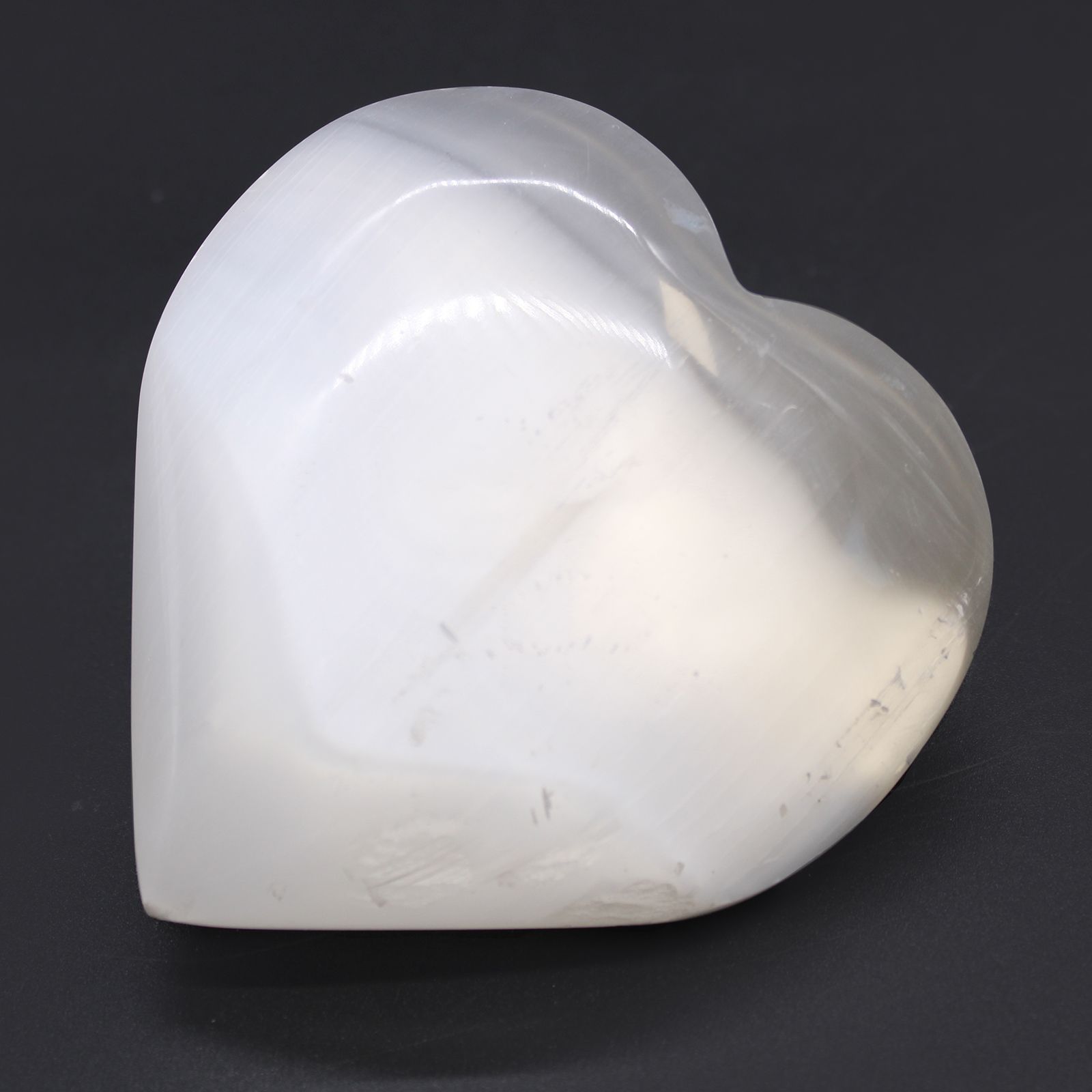 Radiant Selenite Heart – 10 CM heart-shaped selenite crystal, polished white stone decor centerpiece on dark background