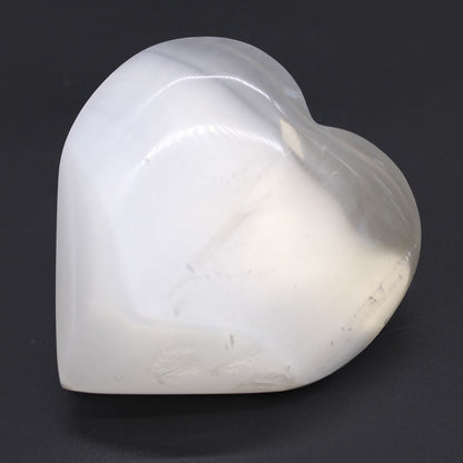 Radiant Selenite Heart – 10 CM heart-shaped selenite crystal, polished white stone decor centerpiece on dark background