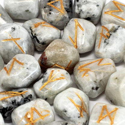 Alt Tag: Rainbow Moonstone Rune Set – 25-Piece Enchantment with polished rainbow moonstone stones featuring gold rune engravings, close-up
