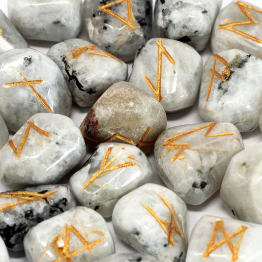 Alt Tag: Rainbow Moonstone Rune Set – 25-Piece Enchantment with polished rainbow moonstone stones featuring gold rune engravings, close-up