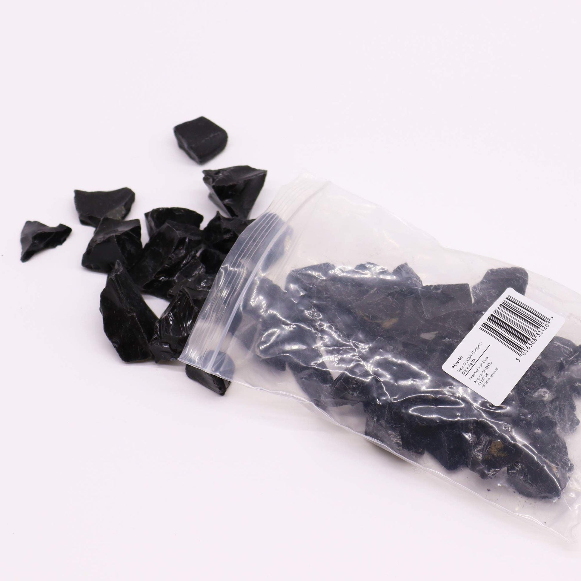 Raw Crystals (500gm) - Black Obsidian raw black obsidian crystal chips in clear zip bag with pieces spilling out