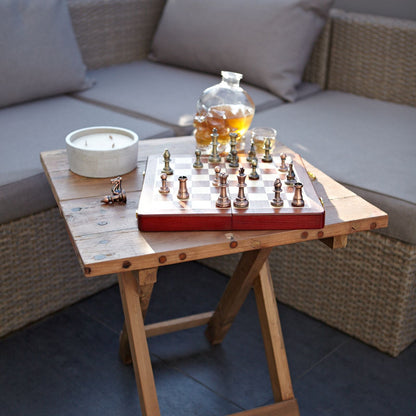 Recycled Teak Folding Coffee Table – 50x50CM with chess set and candle on rustic reclaimed teak folding patio table