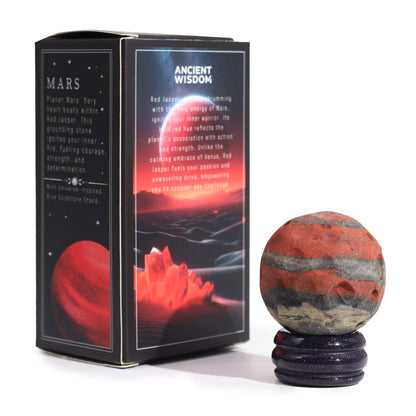 Alt Tag: Red Jasper Mars Gemstone Sphere – 40MM with Goldstone stand beside Mars-themed gift box
