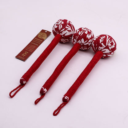 Alt Tag: Red Wormwood Massage Hammer – Wooden Tool set of three red fabric herbal massage hammers with wooden handles on white background