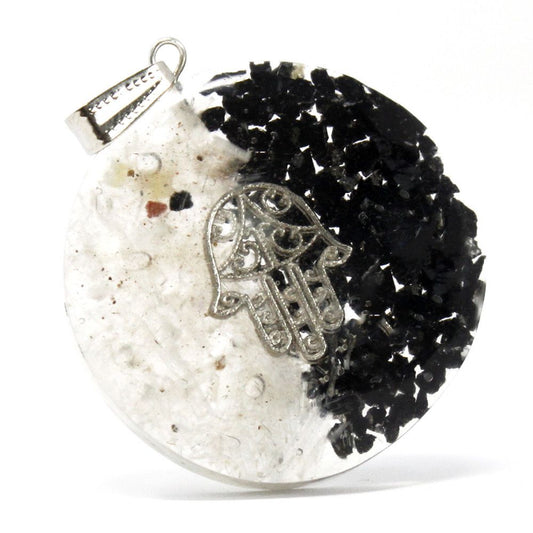 Alt Tag: Resin Gemstone Orgonite Pendant – Good & Evil Hamsa round resin pendant with silver Hamsa charm, black and clear gemstone chips