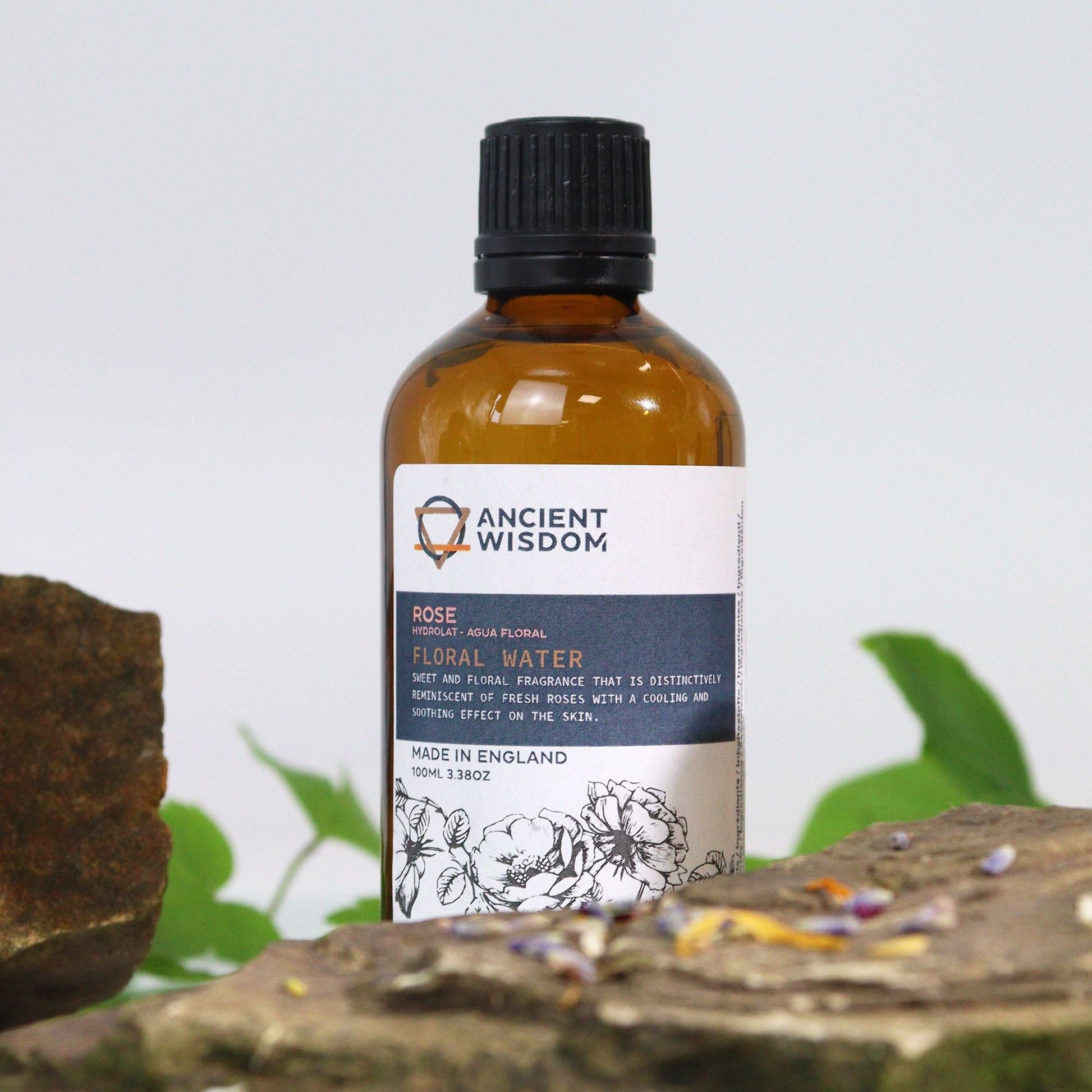 Alt Tag: Rosa Damascena Hydrolat Floral Water – 100ML amber bottle floral water toner 100ml on natural stone backdrop