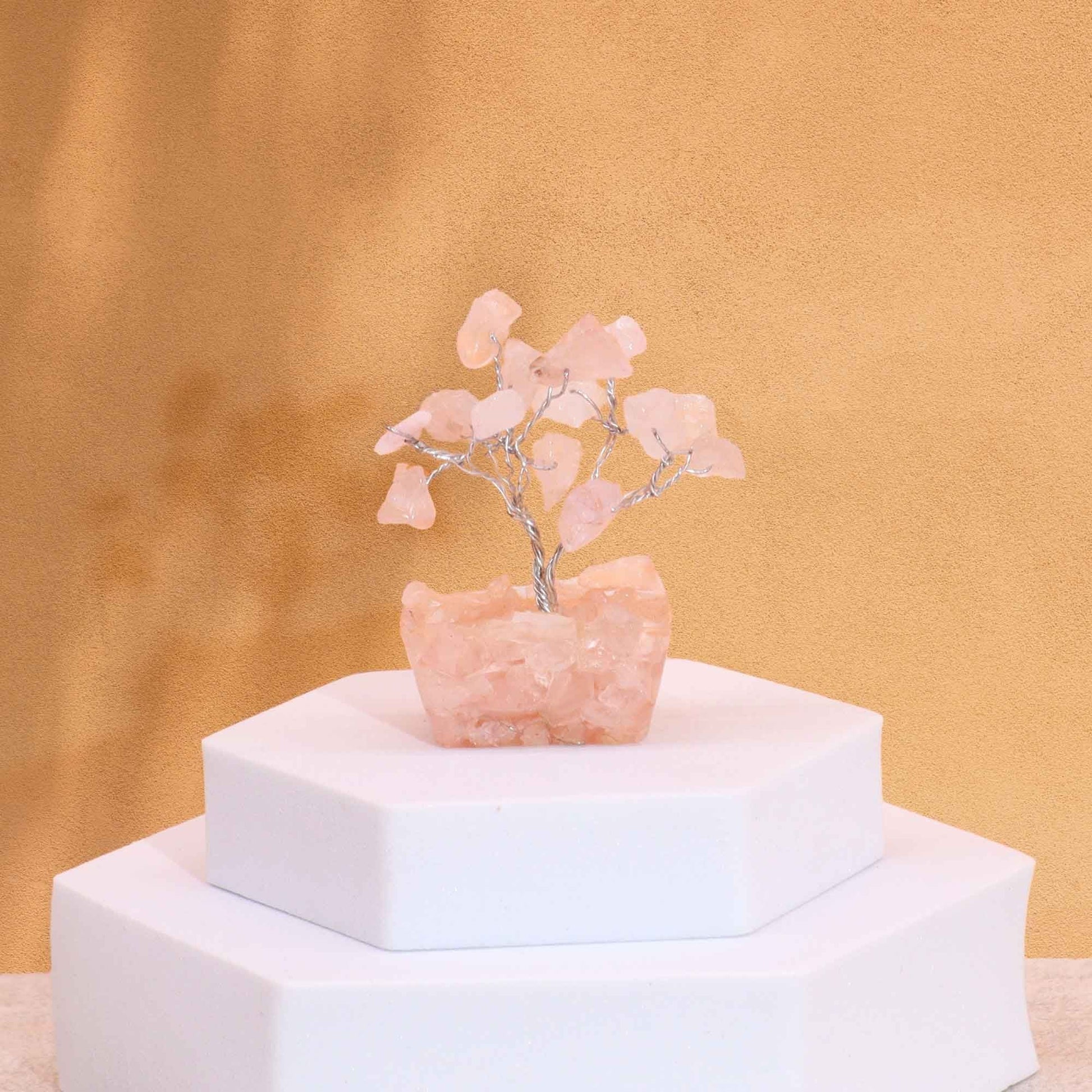 Alt Tag: Rose Quartz Gemstone Tree – Mini, 5CM Height on white display stand, mini rose quartz chipstone tree with silver wire branches