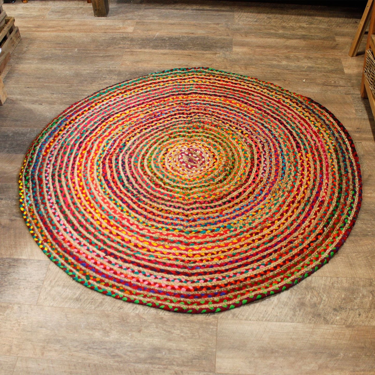 Alt Tag: Round Jute and Recycled Cotton Rug – 150 CM round multicolor braided rug on wooden floor, handwoven jute and recycled cotton texture