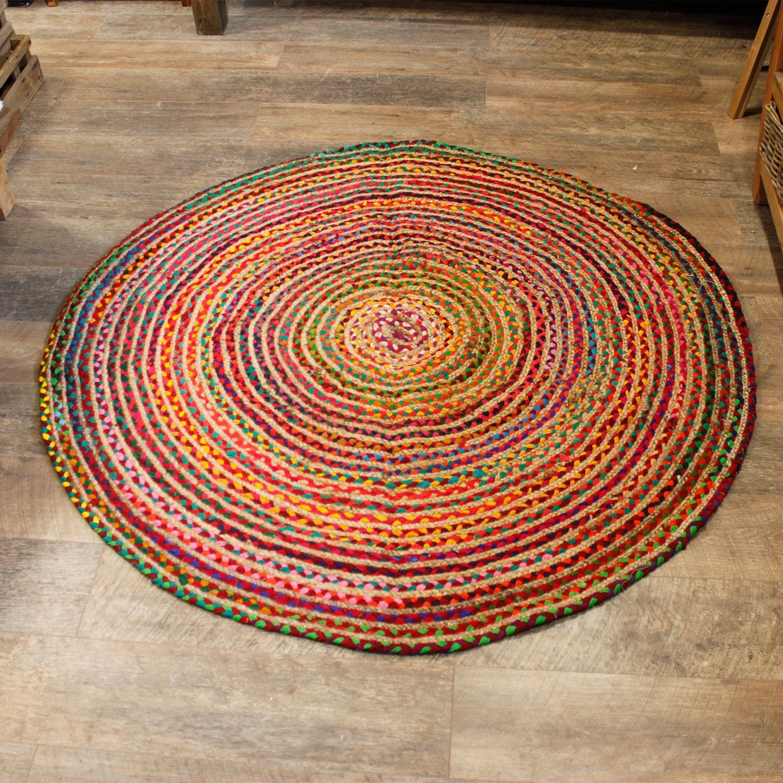 Alt Tag: Round Jute and Recycled Cotton Rug – 150 CM round multicolor braided rug on wooden floor, handwoven jute and recycled cotton texture