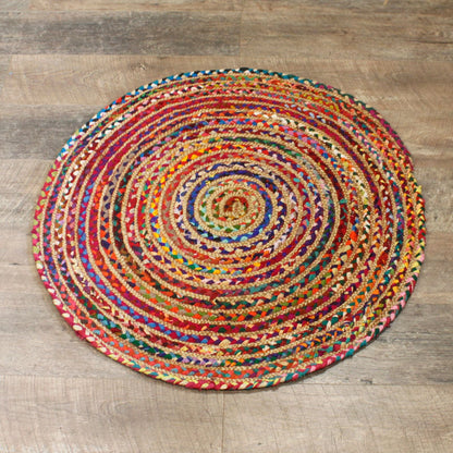 Alt Tag: Round Jute and Recycled Cotton Rug – 90 CM alfombra redonda tejida a mano de yute y algodón reciclado multicolor sobre suelo de madera