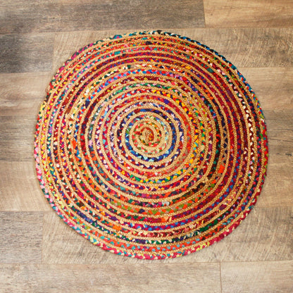 Alt Tag: Round Jute and Recycled Cotton Rug – 90 CM handwoven round rug with colorful recycled cotton weave on wooden floor
