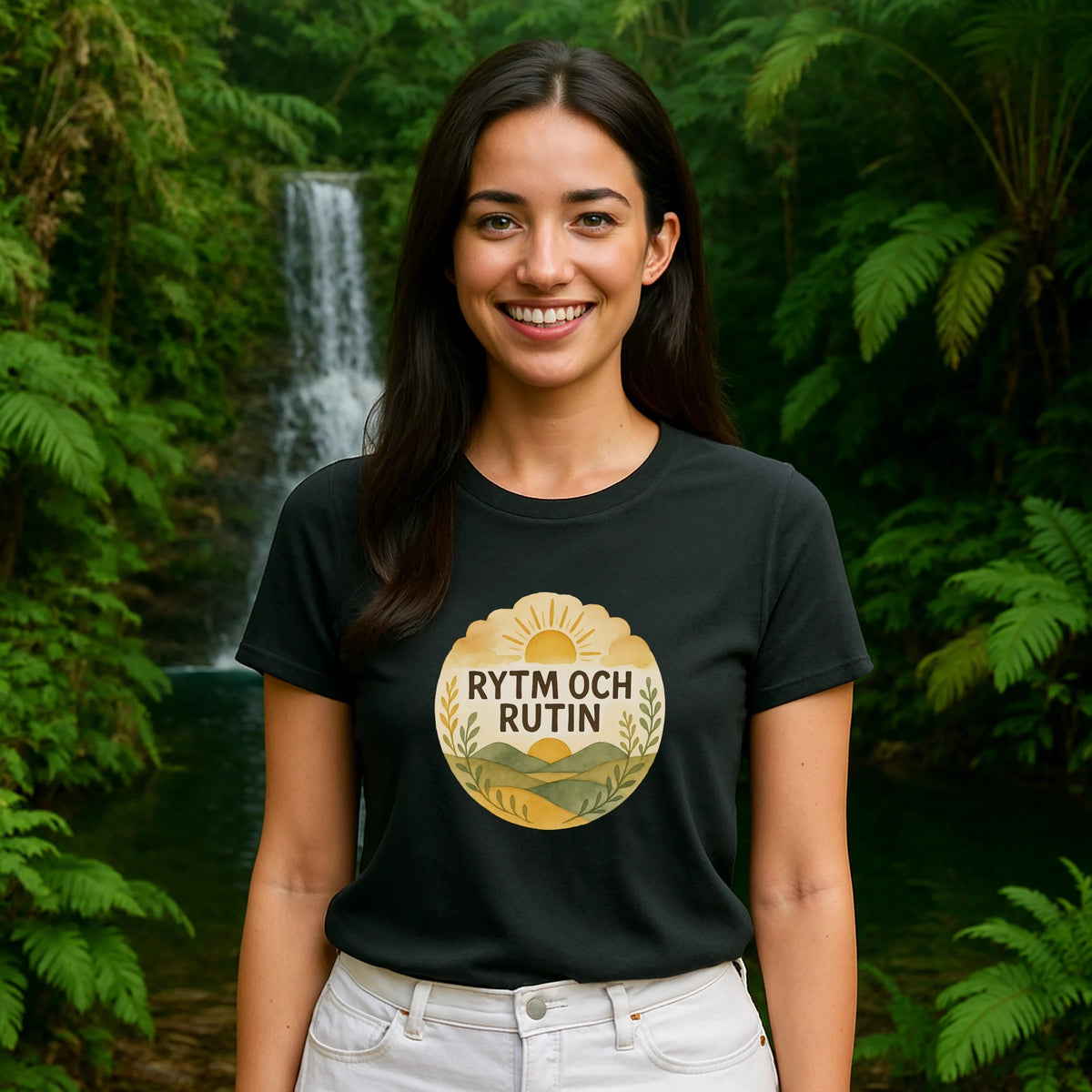 Alt Tag: Rytm Rutin Bomulls Premium Unisex T-Shirt worn by woman, black cotton tee with Rytm Och Rutin graphic, outdoor waterfall