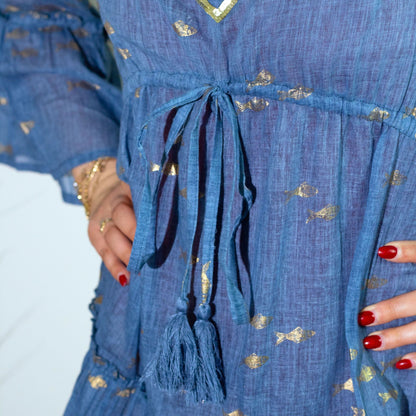 Sea Blue & Gold Fish Nomad Sari Dress – ML close-up of sea-blue fabric with gold fish motifs, waist tie and tassels