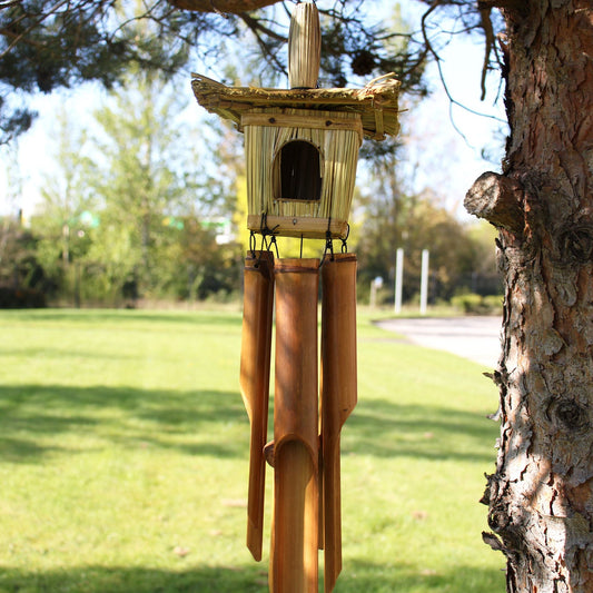 Seagrass Bird Box with Chimes – 49x15 CM hanging birdhouse with bamboo wind chimes on a tree in a sunny garden