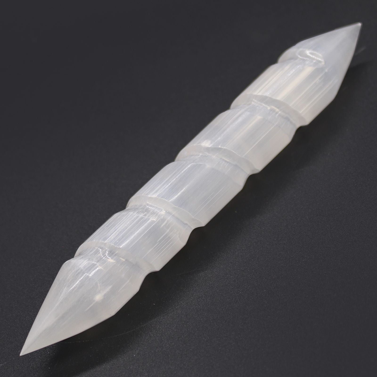 Selenite Spiral Wand – 16 CM Double-Point double-pointed spiral selenite crystal wand, 16 cm, white translucent, on black background