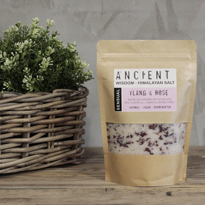Sensual Himalayan Bath Salt Blend – 500G pouch with ylang & rose Himalayan salt crystals on wooden surface