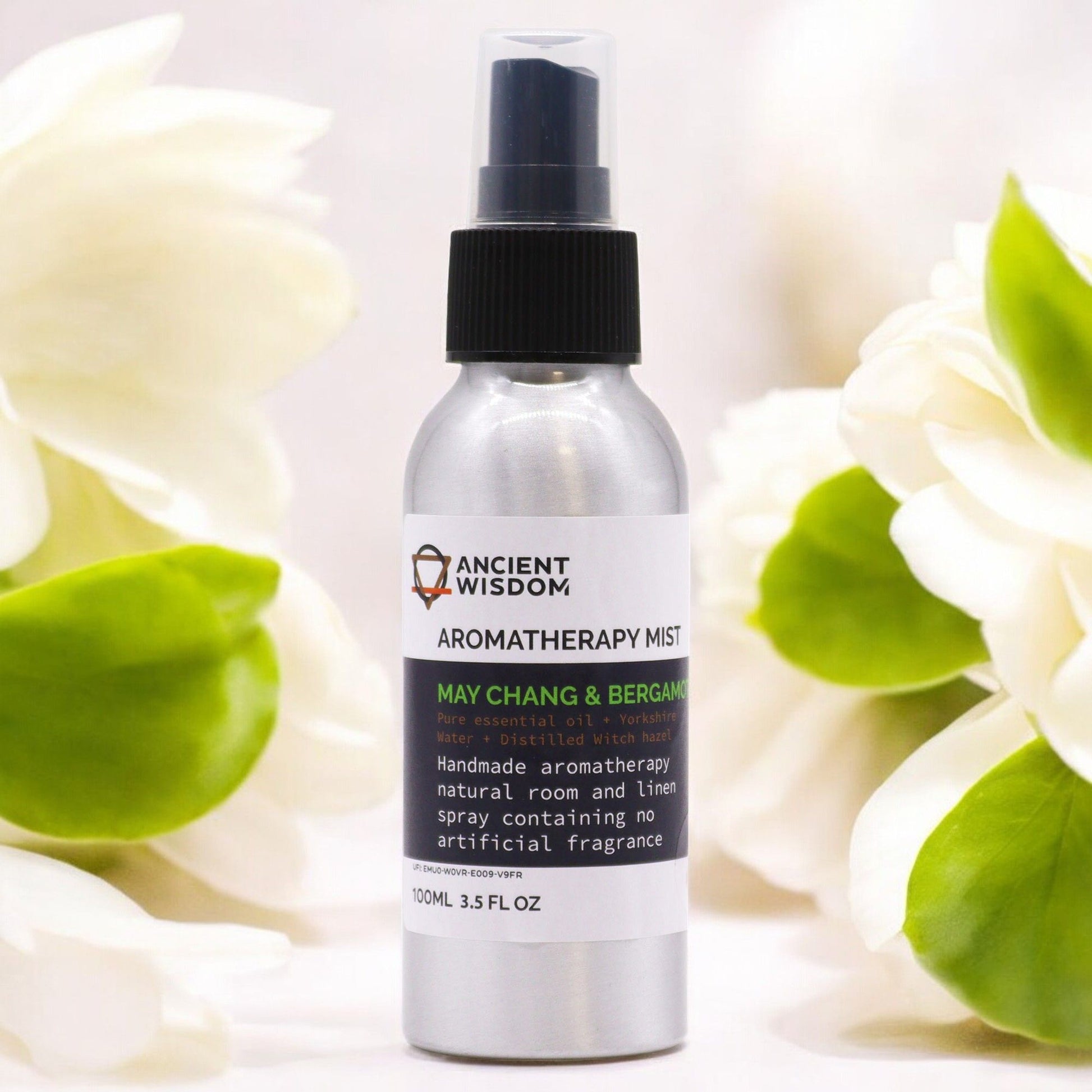 Alt Tag: Serene Bliss Essential Oil Mist – 100ML botella spray aromático May Chang y Bergamot 100 ml sobre fondo floral