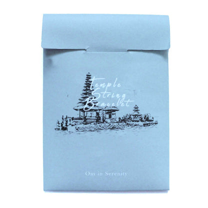 Serenity Om Temple String Bracelet – Unisex packaging envelope with temple illustration and “Temple String Bracelet” text