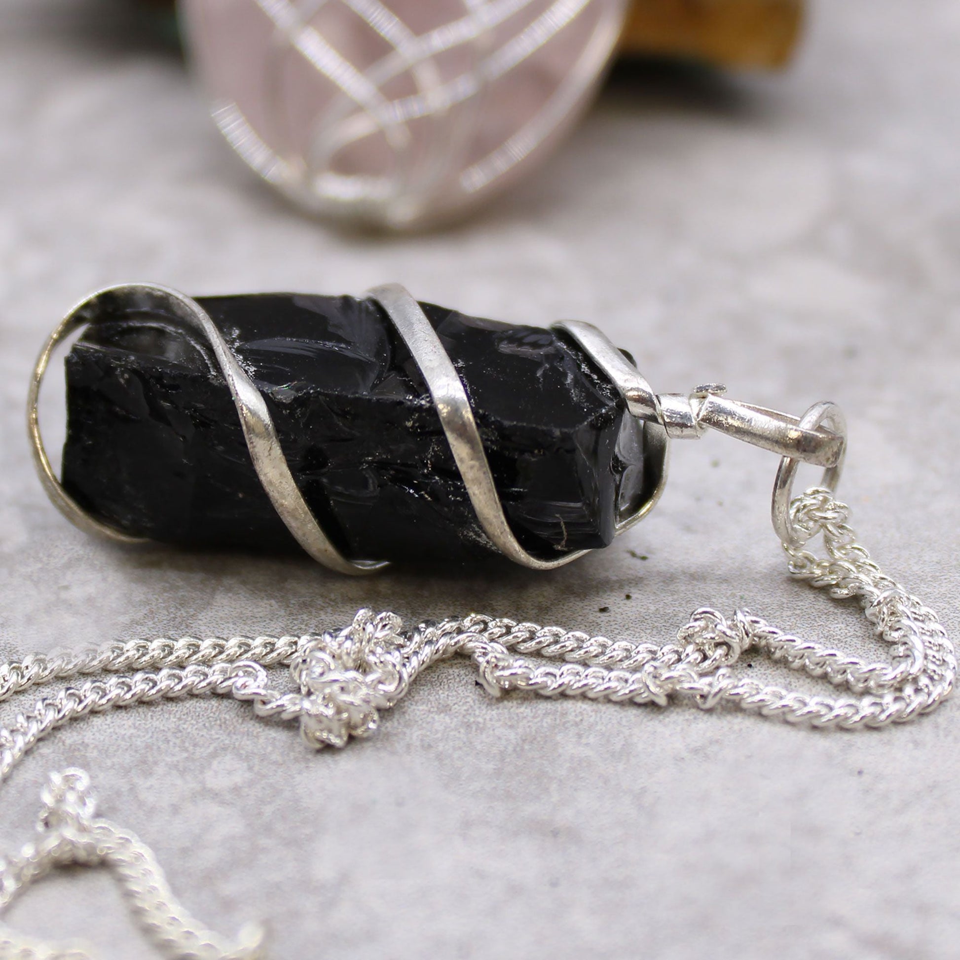 Alt Tag: Silver-Plated Gemstone Necklace – Rough Black Onyx with rough black onyx pendant in silver-plated wire wrap on chain