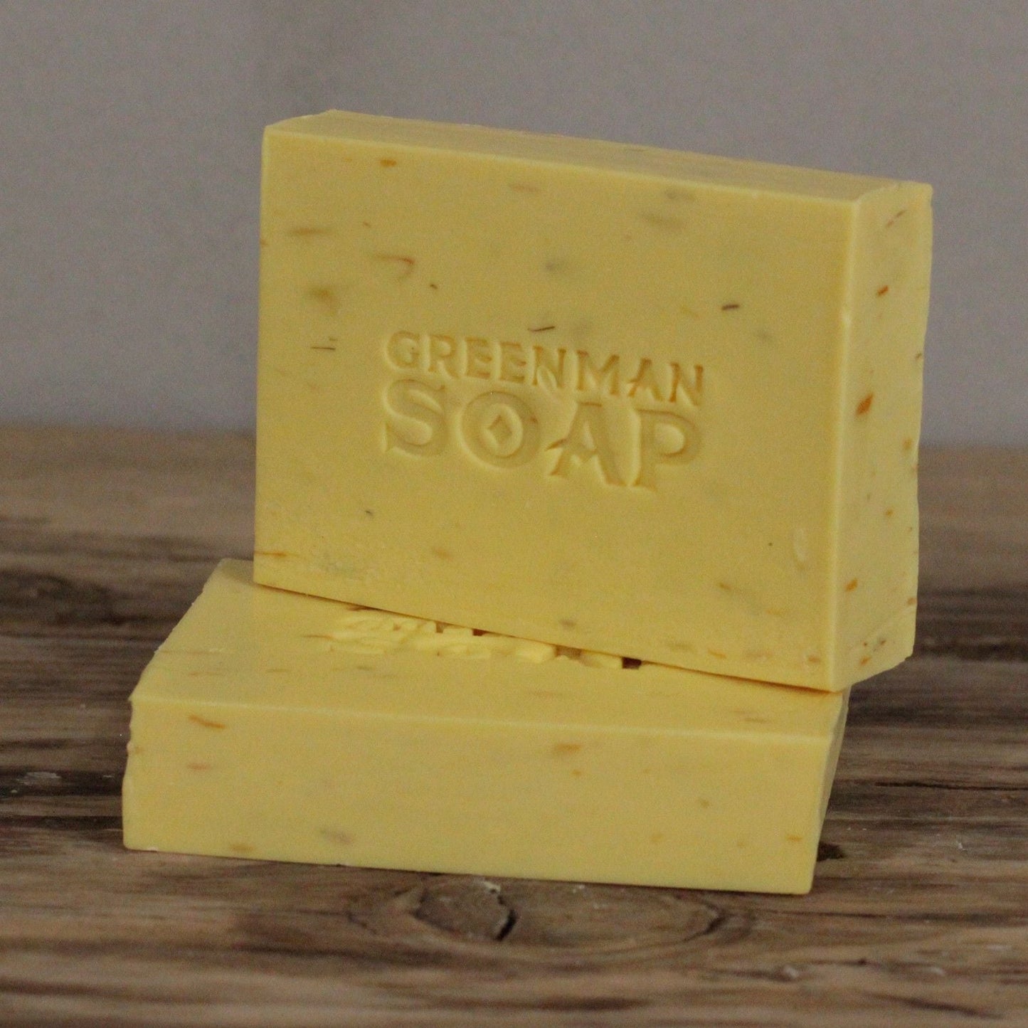 Alt Tag: Sodium Palmate Greenman Soap – 100G Gentle & Kind artisan bar soap, yellow with Greenman Soap logo, with carrot seed and shea butter