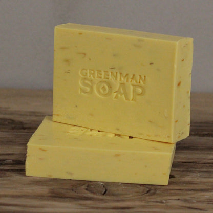 Alt Tag: Sodium Palmate Greenman Soap – 100G Gentle & Kind artisan bar soap, yellow with Greenman Soap logo, with carrot seed and shea butter
