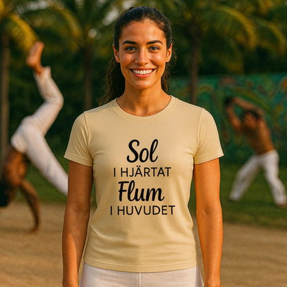 Model wearing Sol I Hjärtat Flum I Huvudet 100% Organic Cotton T-Shirt, beige short-sleeve tee with black text print