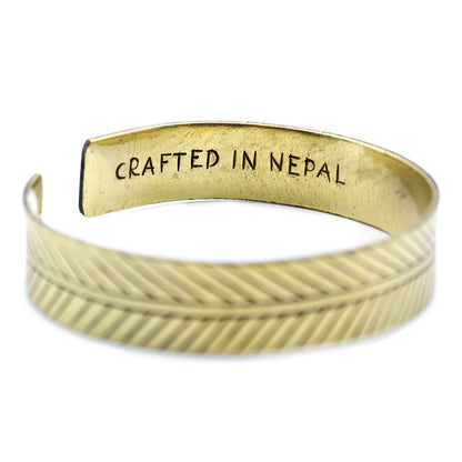 Alt Tag: Solid Brass Tibetan Bracelet – Wide Tribal Leaf, brass cuff with tribal leaf engraving, interior stamped "CRAFTED IN NEPAL"