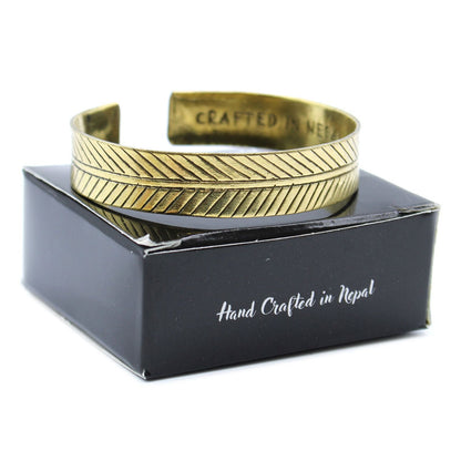 Alt Tag: Solid Brass Tibetan Bracelet – Wide Tribal Leaf brass cuff bracelet with engraved leaf motif, hand crafted in Nepal on black box