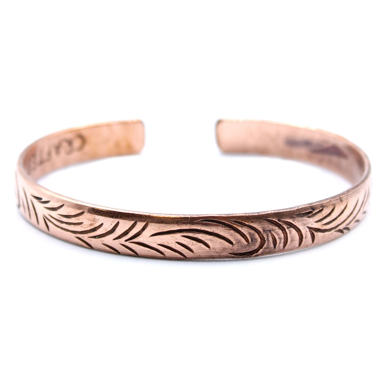 Alt Tag: Solid Copper Tibetan Bracelet – Slim Tribal Swirls open cuff bracelet in solid copper with engraved tribal swirl pattern, front view
