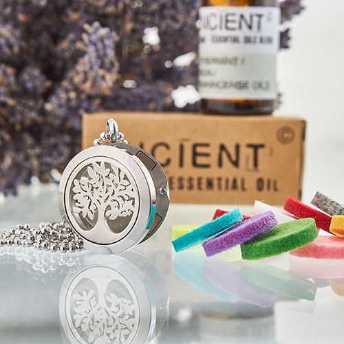 Alt Tag: Stainless Steel Aromatherapy Necklace – Tree of Life 25MM diffuser locket with chain, essential oil bottle and colorful felt pads