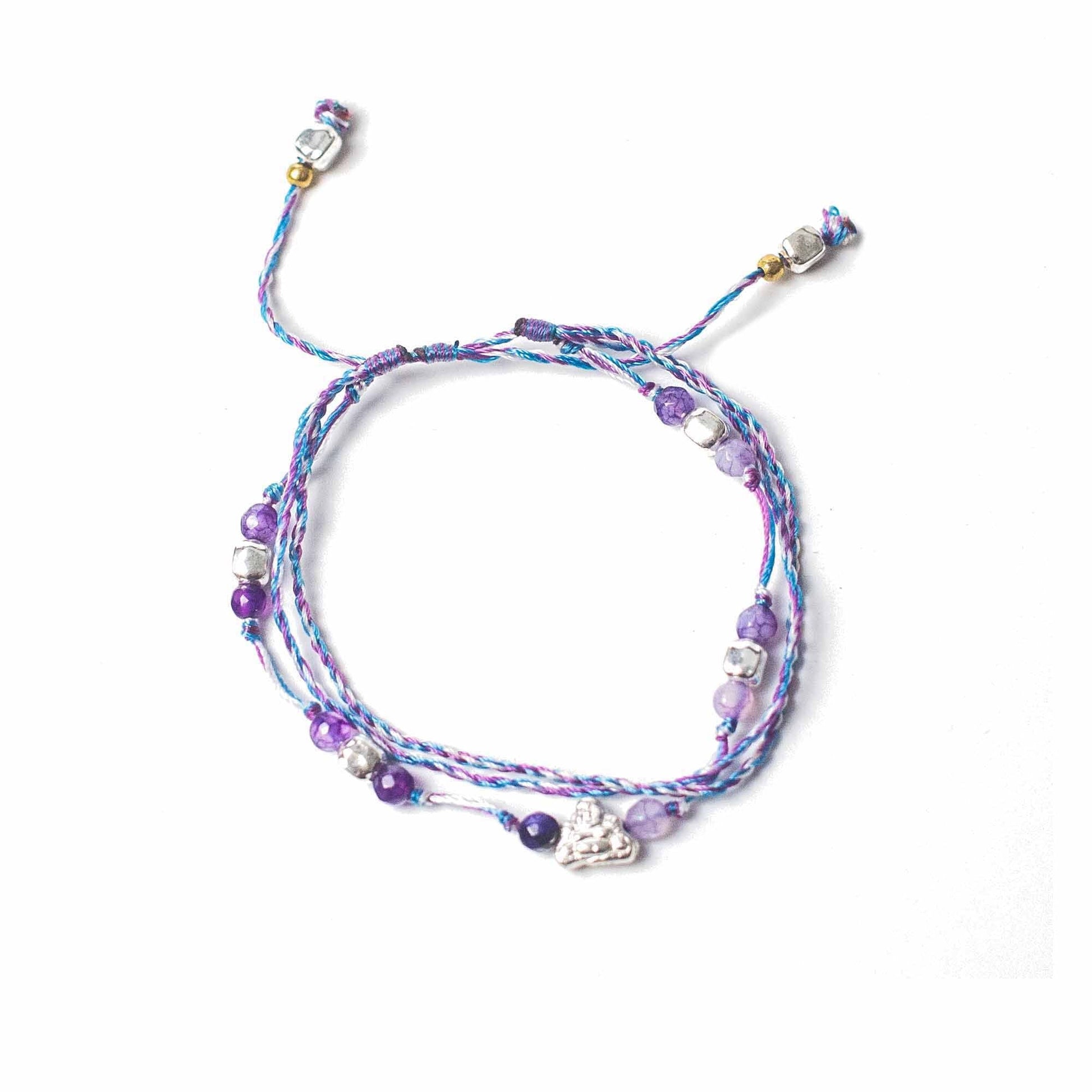 String & Beads Temple Bracelet – One Size adjustable braided string bracelet with metal accents and purple beads, top view on white