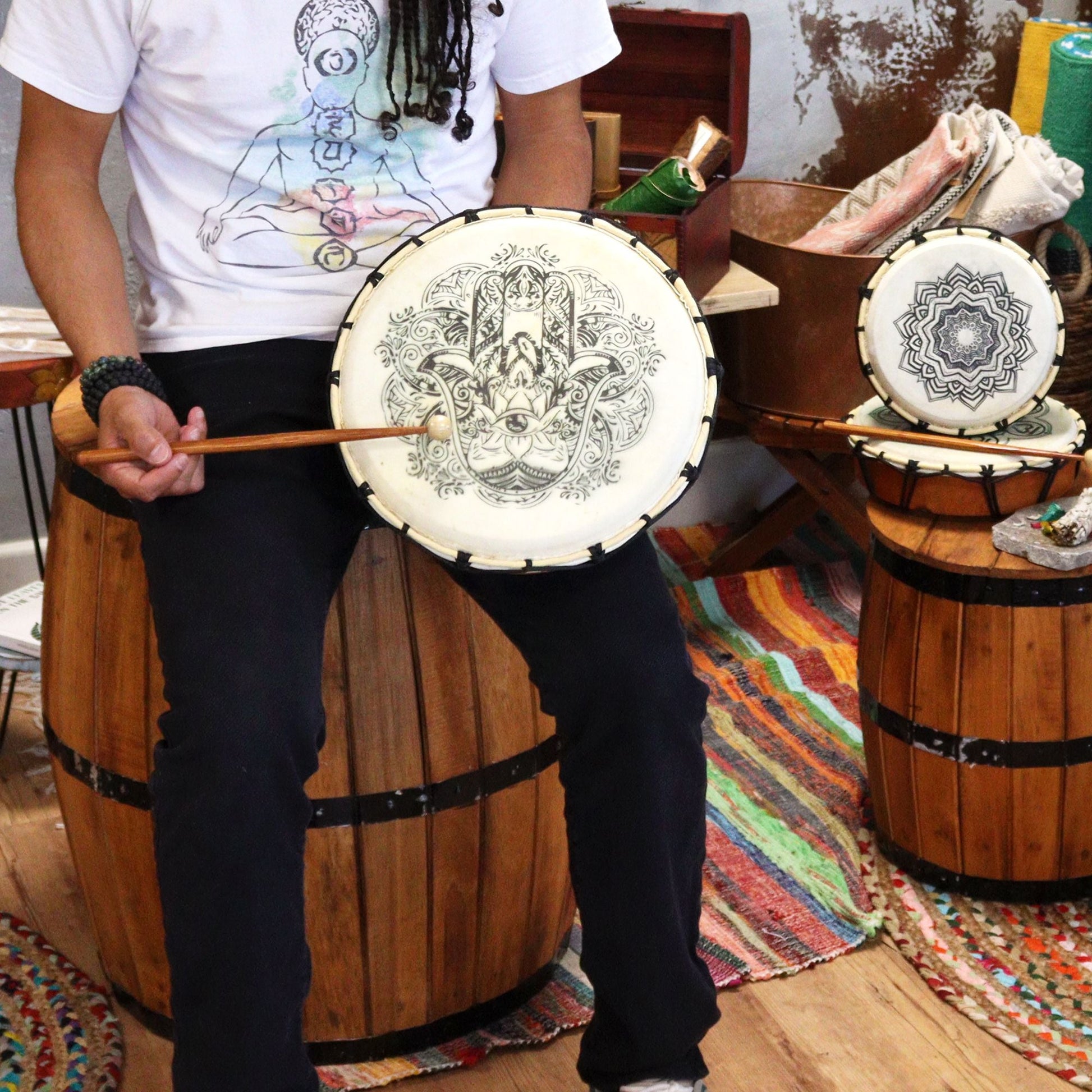 Suar Wood Hamsa Shamanic Drum – 30 CM held on lap with mallet, featuring Hamsa hand design on drumhead