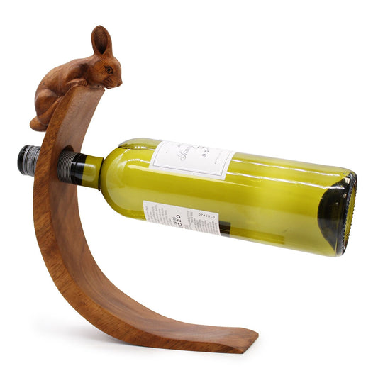 Suar Wood Rabbit Bottle Holder – 6x20x27 CM holding a wine bottle, handcrafted suar wood rabbit stand with curved base