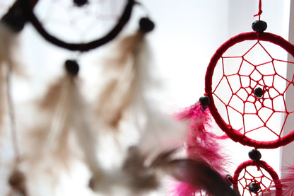 Alt Tag: Synthetic Suede Bali Dream Catcher – 22 CM in black, white and red with woven web, beads and vibrant feathers hanging decor