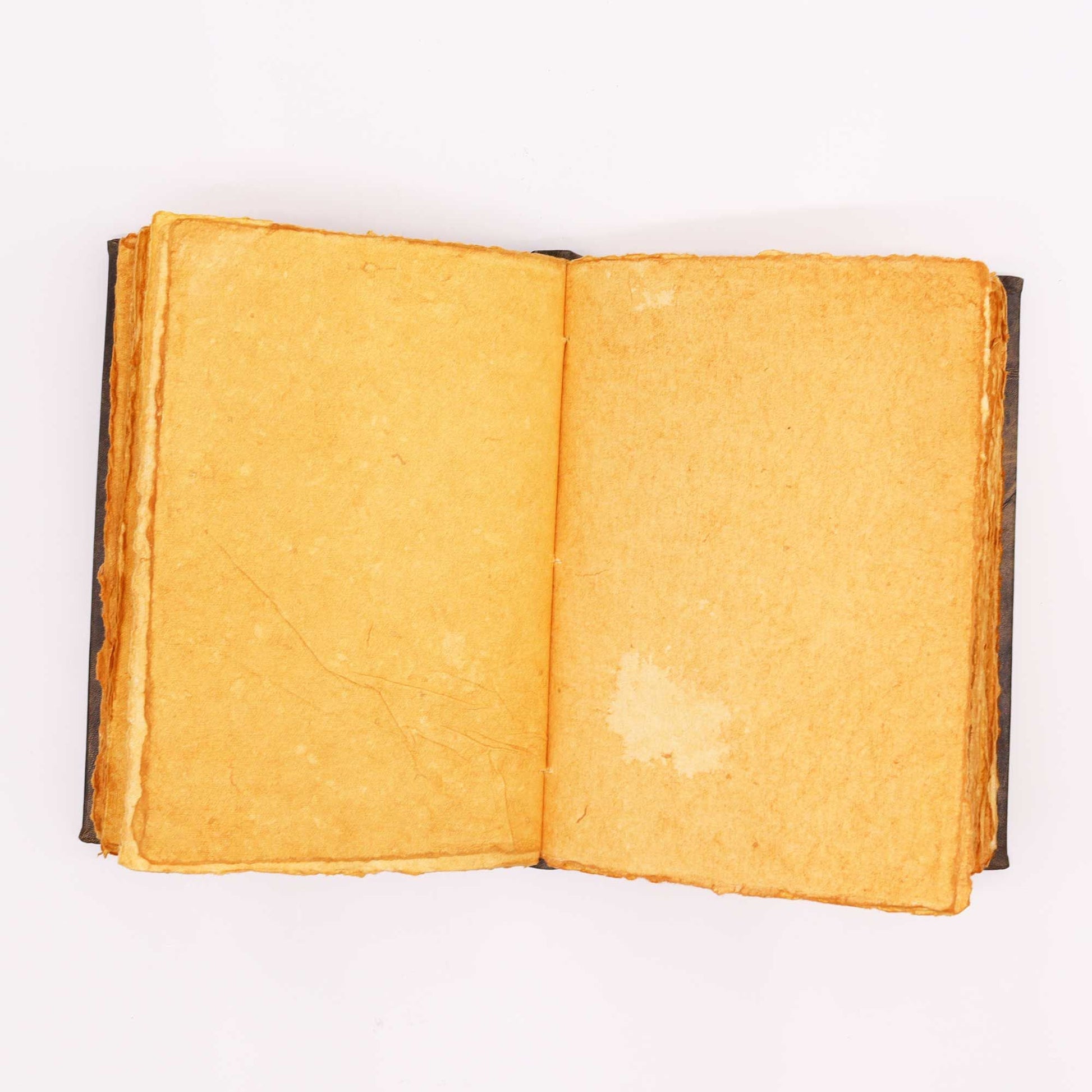 Tan Leather Notebook – Zinc Pentagon 26x18 CM open view showing deckle-edge blank pages and leather cover edges