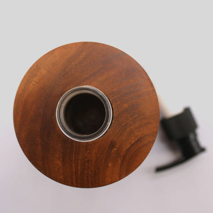 Alt Tag: Teakwood Soap Dispenser – Taper Design top view, teak wood soap dispenser bottle opening with black pump on white surface