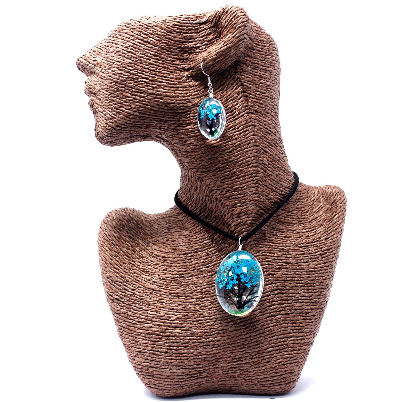 Teal Tree of Life Necklace – Glass & Flowers, oval glass pendant with teal tree motif on black cord, shown on mannequin bust