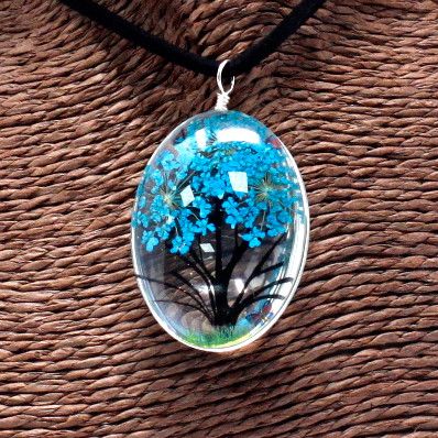 Alt Tag: Teal Tree of Life Necklace – Glass & Flowers, oval glass pendant with teal flowers and tree silhouette on black cord