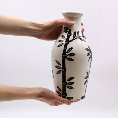 Alt Tag: Terracotta Bamboo Motif Vase – 30x14 CM, white terracotta vase with black bamboo design, held in hands
