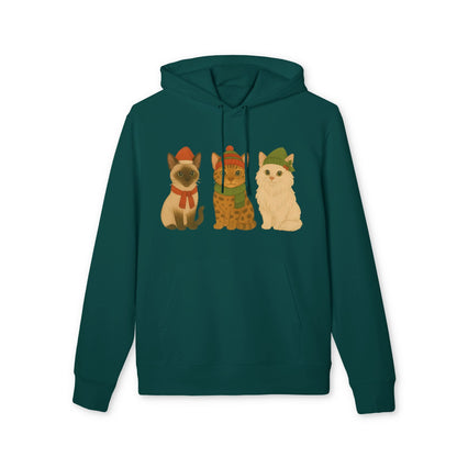 Three Little Cats Christmas Premium Unisex Hoodie en verde azulado con tres gatos navideños ilustrados en el pecho