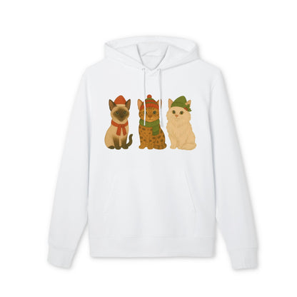 Three Little Cats Christmas Premium Unisex Hoodie blanco con ilustración de tres gatos festivos con gorros navideños en el frente