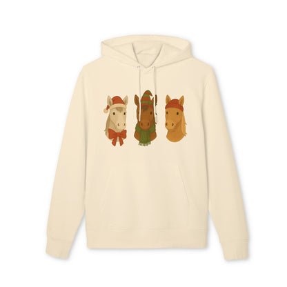 Alt Tag: Three Little Horses Christmas Sustainable Unisex Hoodie in cream with three festive horse graphic wearing winter hats