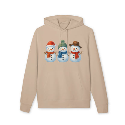 Three Little Snowmen Christmas Premium Unisex Hoodie beige organic cotton hoodie with three smiling snowmen graphic
